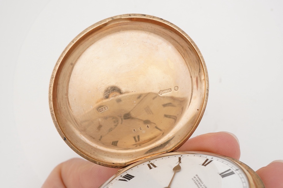 A George V 9ct gold hunter keyless lever pocket watch, by Russells Ltd of Liverpool, with Roman dial and subsidiary seconds, case diameter 48mm, gross weight 89 grams, with a leather suspension strap with rolled gold T-b